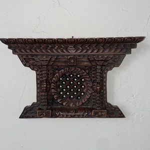 Hand carved traditional Nepali wooden window.